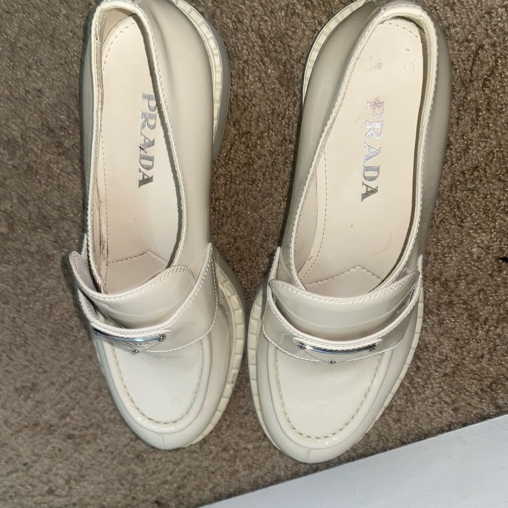 Prada Women's Ivory Loafers with Silver Accent